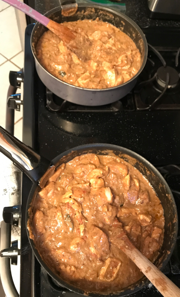 butter chicken at a cooking lesson we conducted. side by side pans