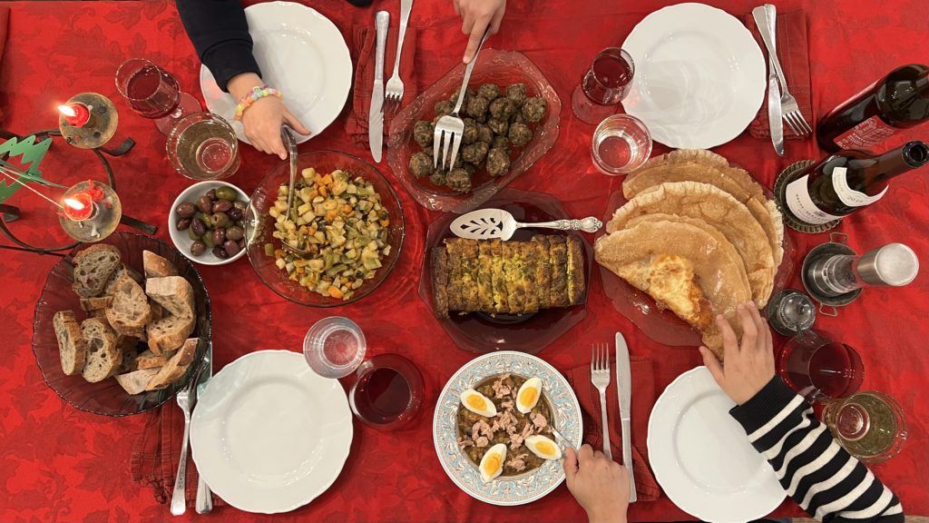 table and hands for home-cooked tunisian feast