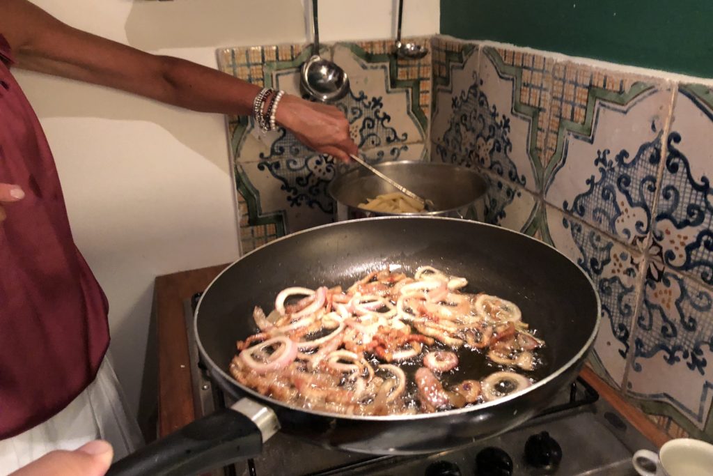 guanciale and shallots cooking for carbonara